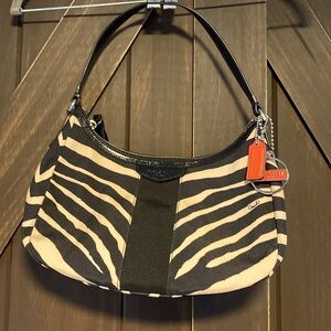 Coach- Shoulder Zebra Print Tan and Black with orange Coach Charms
